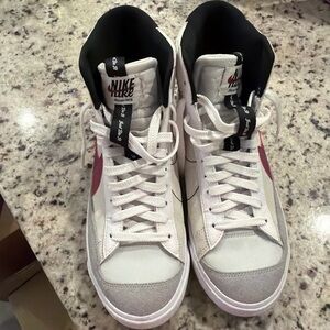 Nike White High-Top Sneakers with Pink Swoosh